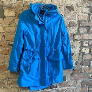 Bright baby blue JCrew rain coat.